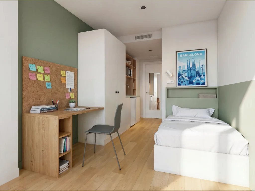Habitación individual con escritorio y cama en Camplus Barcelona Poblenou
